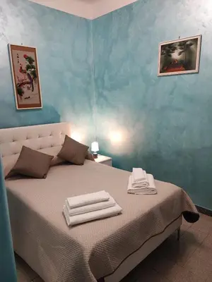 a bedroom with a bed with towels on it at Iannilli Casa Vacanze in Rome