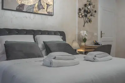 a bedroom with two towels on a bed at Piazza del Popolo - The Heart of Rome in Rome