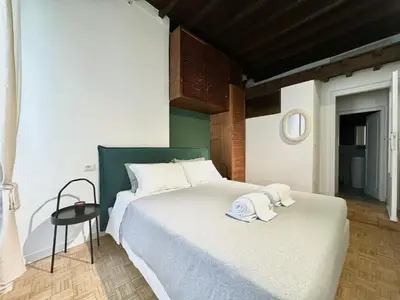 a bedroom with two beds with towels on them at Luxury Apartment Historic Center in Rome