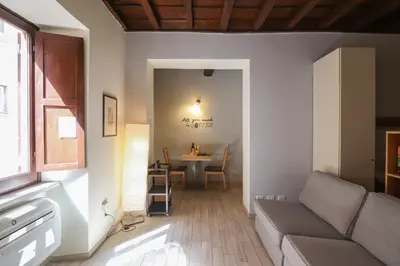 a living room with a couch and a table at Ciambella Cozy Flat in Rome