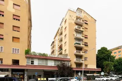 a tall building with cars parked in front of it at Balduina Retreat Terrace in Rome