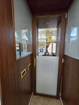 a door in a room with a window and a door at The Etrurian Rapsody in Rome