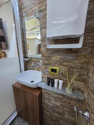 a bathroom with a sink and a mirror at The Etrurian Rapsody in Rome