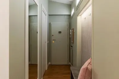 a hallway with a door leading to a room at Rasella 21 - FromHometoRome in Rome