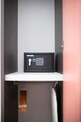 a microwave sitting on top of a shelf at Trastevere New Luxury Rooms in Rome