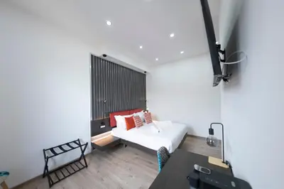a bedroom with a bed and a table in a room at Trastevere New Luxury Rooms in Rome