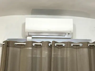 a dvr and a television on top of a shower curtain at Oasi Floreale - Roma Termini in Rome