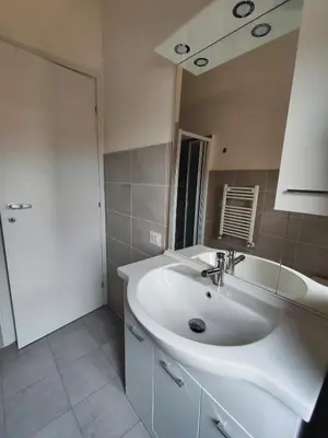 a bathroom with a white sink and a mirror at Casa Cornelia Station in Rome