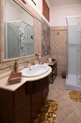 a bathroom with a sink and a shower at Interno 6 in Rome