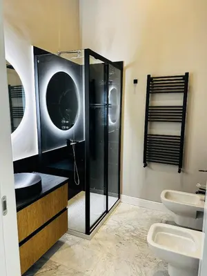 a bathroom with a shower and a sink and a toilet at Via Veneto Luxury Maison in Rome