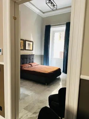 a bedroom with a bed and a window at Via Veneto Luxury Maison in Rome
