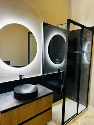 a bathroom with a sink and a glass shower at Via Veneto Luxury Maison in Rome