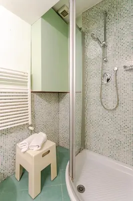a bathroom with a shower and a tub and a sink at Trastevere - Dolce Vita 4bedr 360 Terrace in Rome