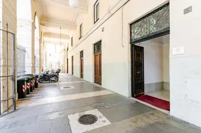 a hallway of a building with motorcycles parked at Trastevere - Dolce Vita 4bedr 360 Terrace in Rome