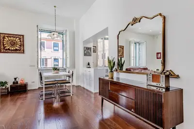 a room with a mirror and a dresser and a desk at Casa Jordan 47 in Rome