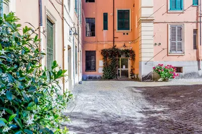 an alley in an old town with pink buildings at Casa Jordan 47 in Rome