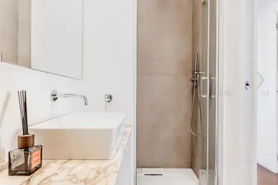 a bathroom with a sink and a shower at Casa Jordan 47 in Rome