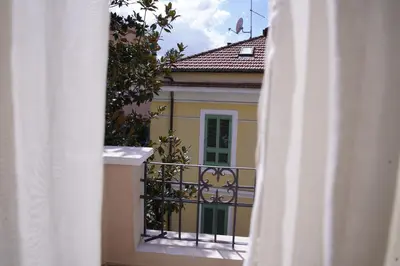 a view from a balcony of a house with a fence at VILLA LINA - sky earth liberty villa - 5 min from tube in Rome