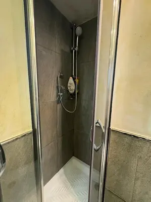 a shower with a glass door in a bathroom at Domus Musei Vaticani Roma Centro 