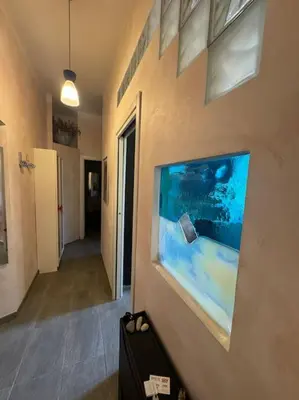 a wall with a picture of an aquarium on it at Domus Musei Vaticani Roma Centro 