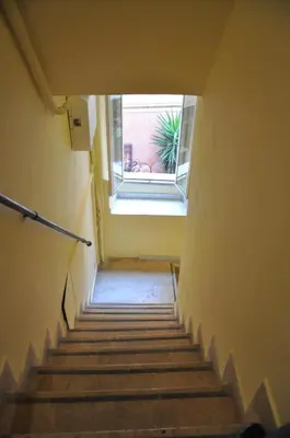 a staircase leading up to a window in a building at Casa del Giglio in Rome