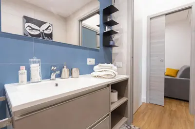 a bathroom with a sink and a mirror at GES House Roma in Rome