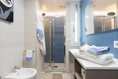 a bathroom with a sink and a shower at GES House Roma in Rome