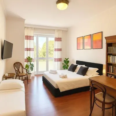 a bedroom with a bed and a table and chairs at Flaminia Design Apartment - GR HOME in Rome