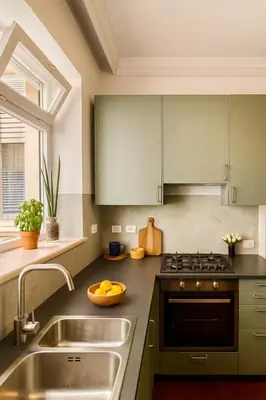 a kitchen with a sink and a stove at Flaminia Design Apartment - GR HOME in Rome