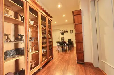 a room with wooden cabinets and a dining room at Flaminia Design Apartment - GR HOME in Rome