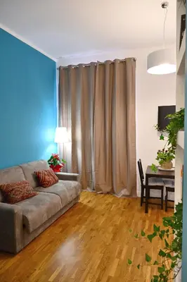a living room with a couch and a table at At Home Montebello in Rome