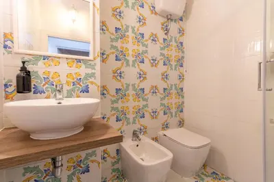 a bathroom with a sink and a toilet at Joe Litty Rooms in Rome