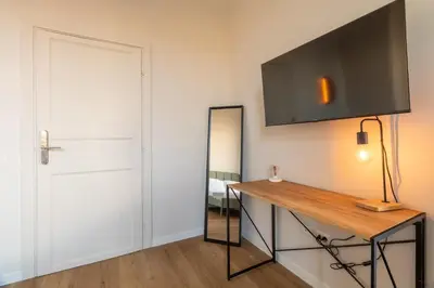 a room with a table and a mirror and a door at Joe Litty Rooms in Rome