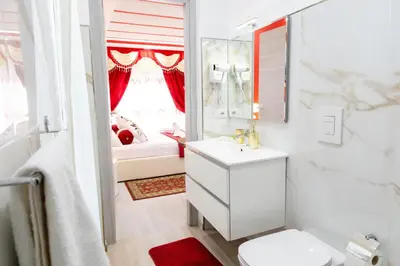 a bathroom with a white sink and a mirror at La Dolce Casa in Rome