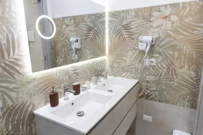 a bathroom with a sink and a mirror at La Dolce Casa in Rome