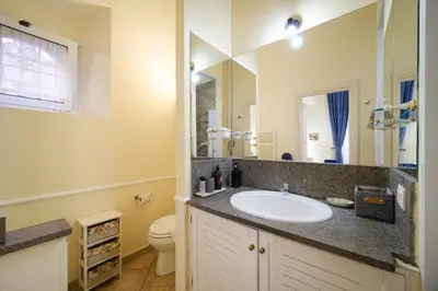 a bathroom with a sink and a toilet at La Casa del Capitano by BuddyRent in Rome