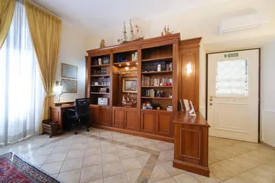 a home office with a desk and a window at La Casa del Capitano by BuddyRent in Rome
