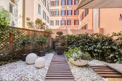 a garden with plants and a walkway at Barberini - FromHometoRome in Rome