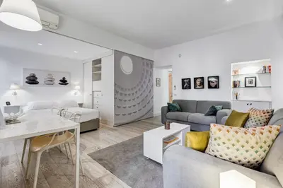 a living room with a couch and a table at Barberini - FromHometoRome in Rome