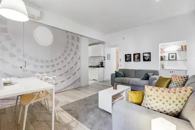 a living room with a couch and a table at Barberini - FromHometoRome in Rome