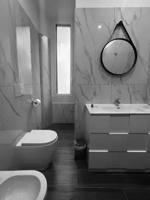 a bathroom with a sink toilet and a mirror at Pantheon 15 in Rome