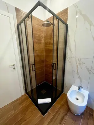 a bathroom with a shower and a toilet at Pantheon 15 in Rome
