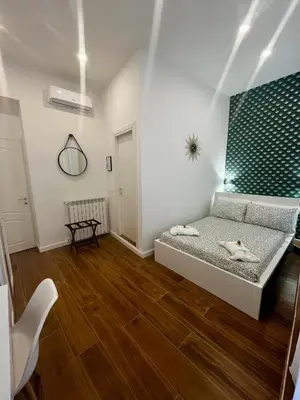a bedroom with a bed with two pillows on it at Pantheon 15 in Rome