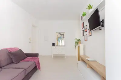 a living room with a couch and a tv at Nextovatican Apartment in Rome