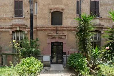 an entrance to an old building with a door at Testaccio - FromHometoRome in Rome