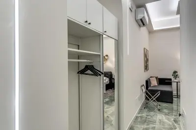 a hallway with a glass door leading to a bedroom at Adriana 5 Luxury rooms in Rome