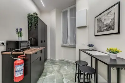 a kitchen with a fire hydrantacistacistacistacistacist at Adriana 5 Luxury rooms in Rome