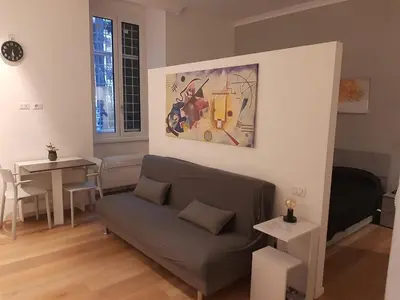 a living room with a couch and a table at Liberty Home in Rome