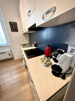 a kitchen with a counter with a coffee maker on it at Liberty Home in Rome