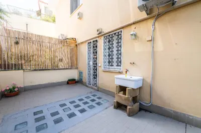 a bathroom with a sink on the side of a building at Magiù Apartment in Rome